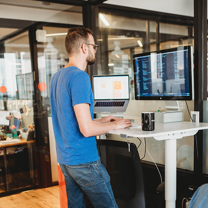 thoughtbot Developer working on Rails project at computer